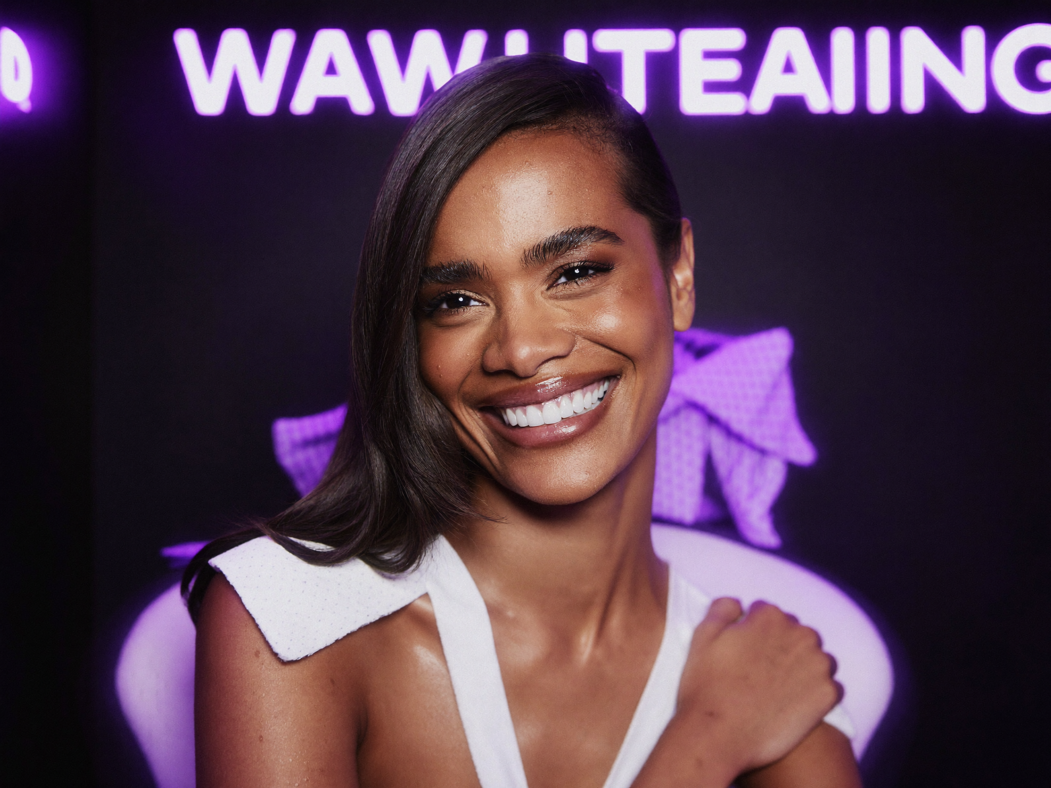 Glowing bright smile in a neon-lit whitening studio