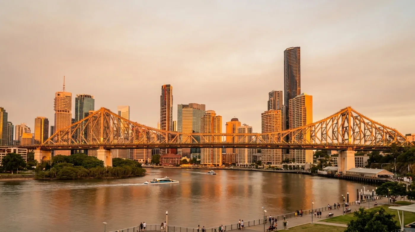 Brisbane city skyline at golden hour across the river