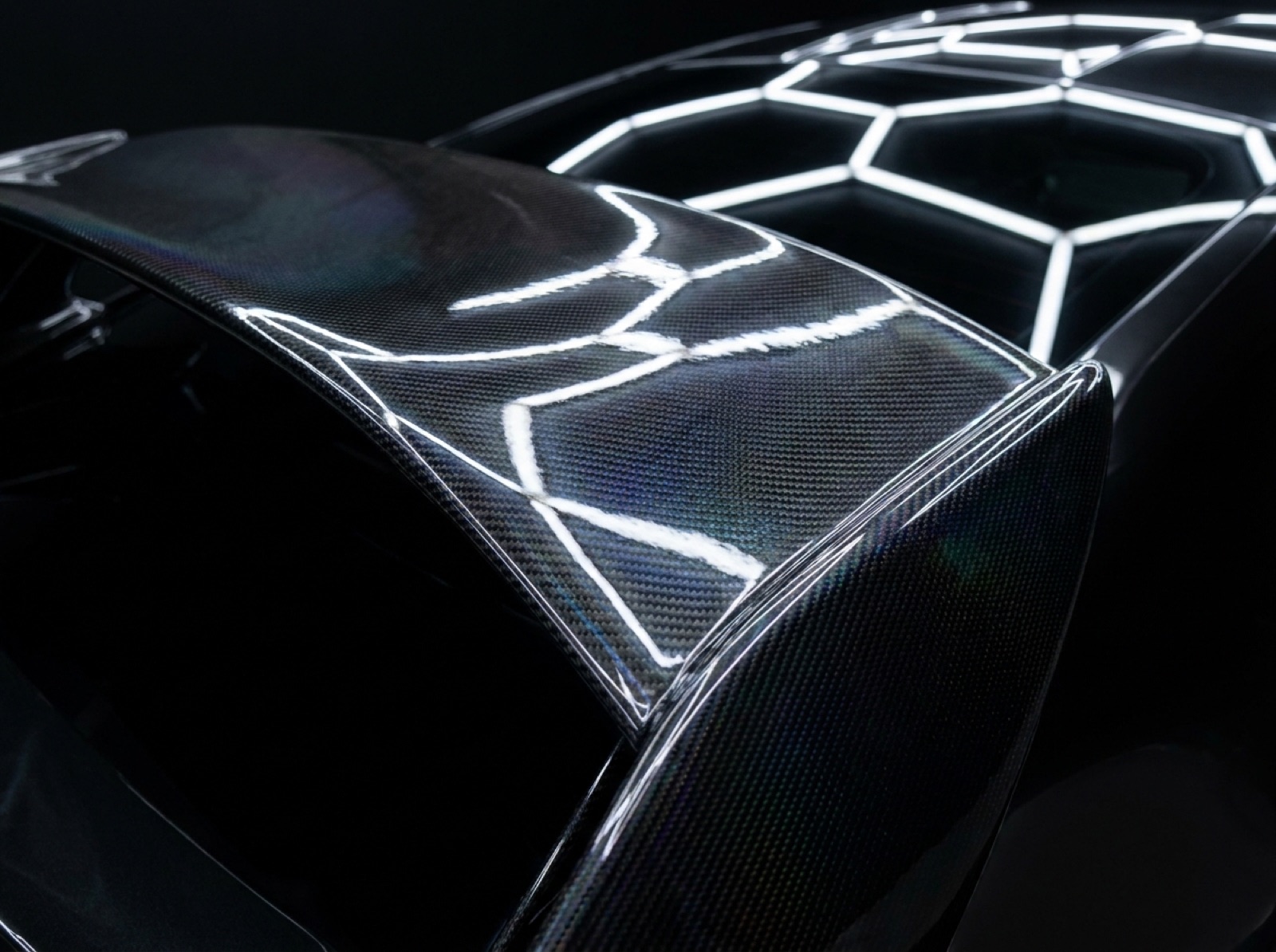 Carbon-fibre spoiler with clear-coat protection
